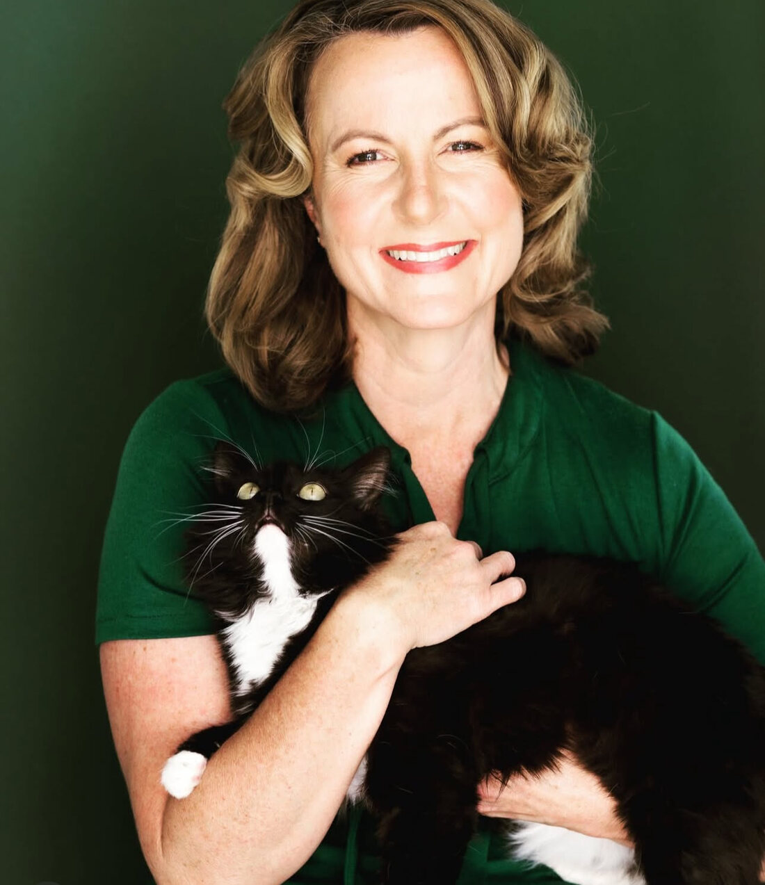 Grace H Bryan smiling with her cat