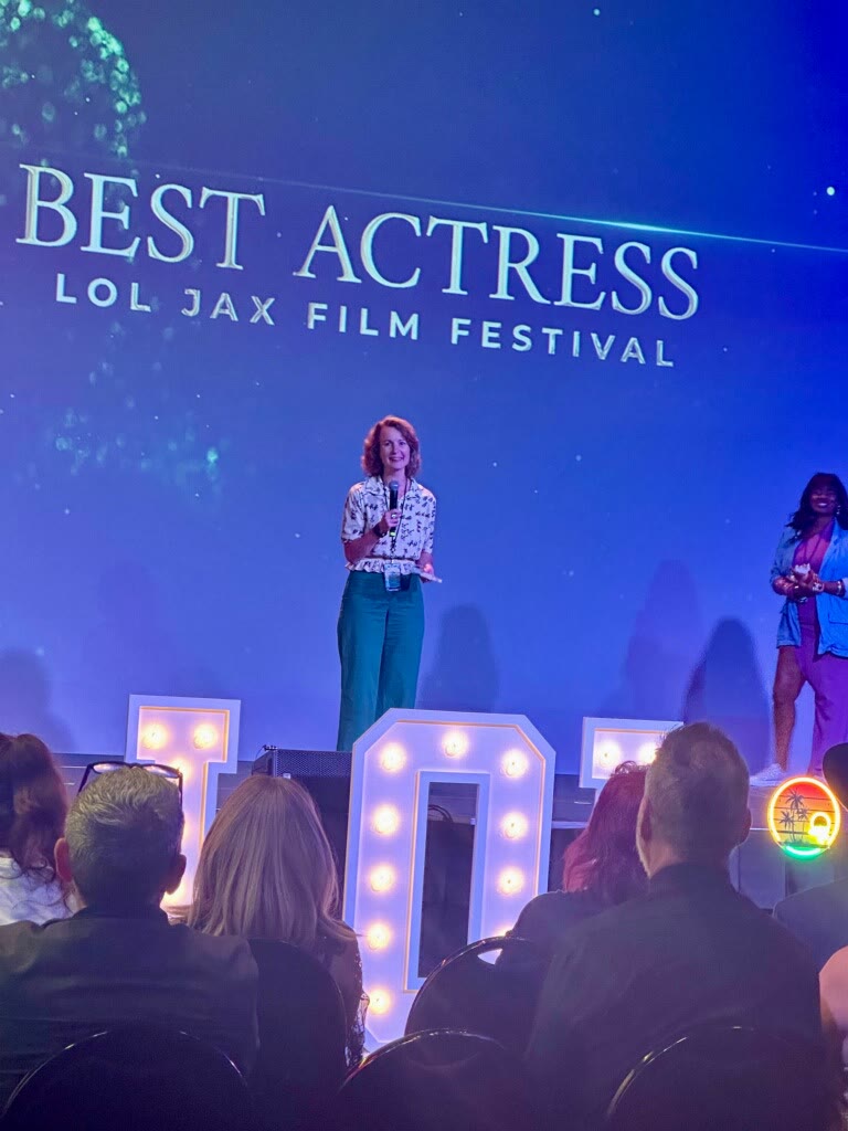 Grace H Bryan receiving a best actress award