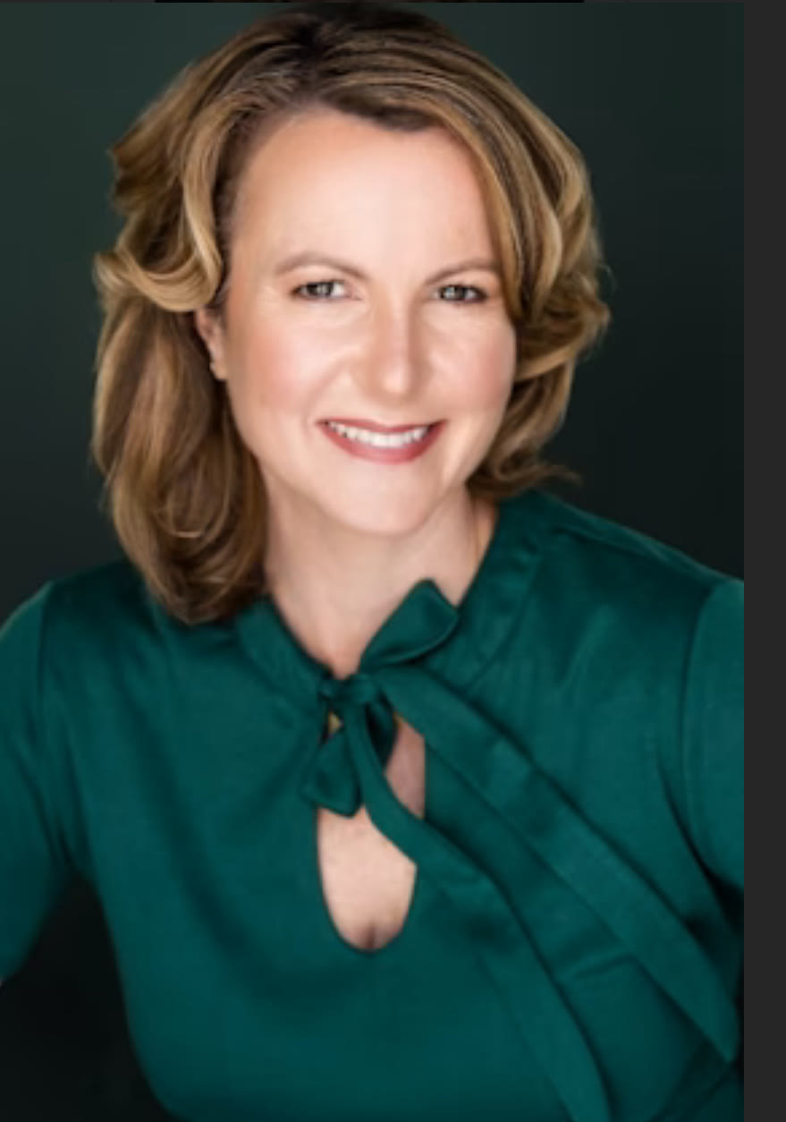 Grace H Bryan green blouse headshot