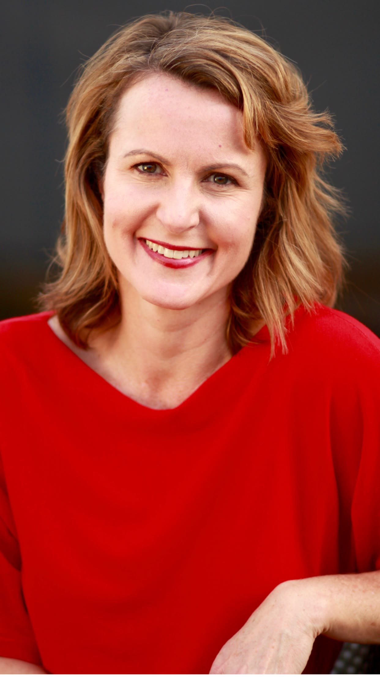 Grace H Bryan red top headshot