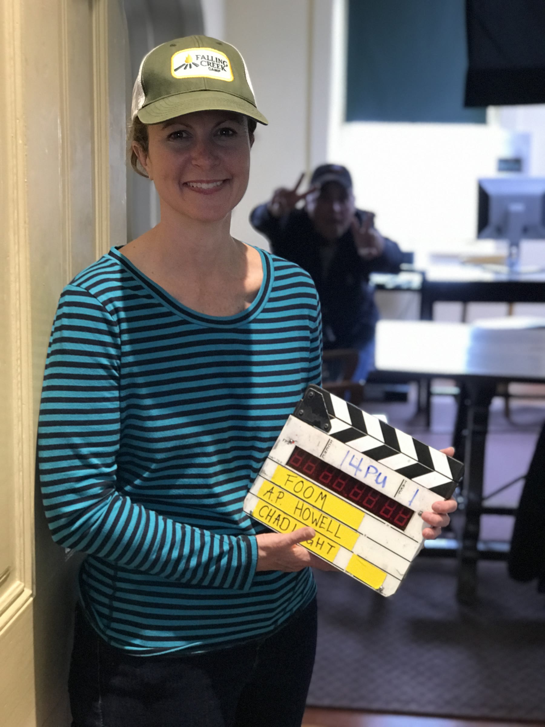 Grace H Bryan with a clapper board