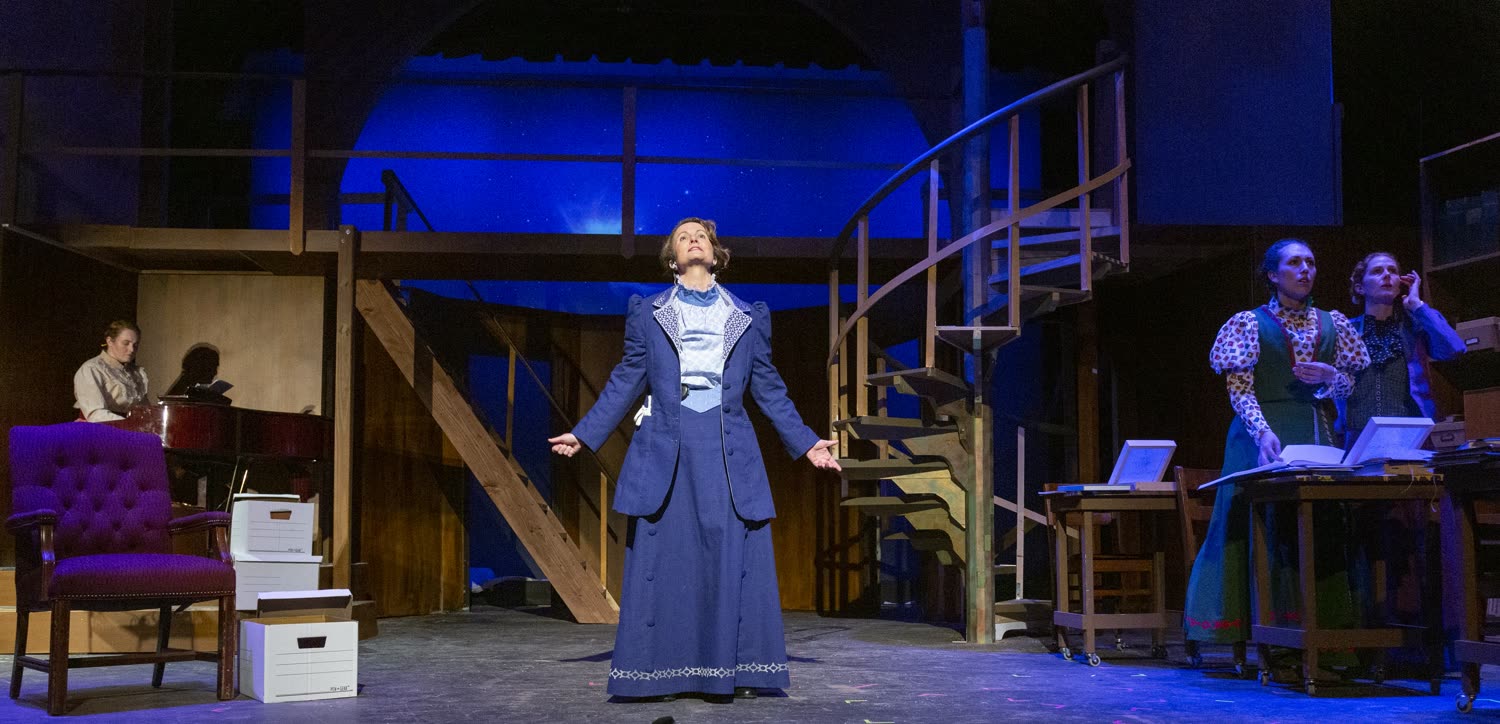 Grace H Bryan on stage in a wide Silent Sky production scene